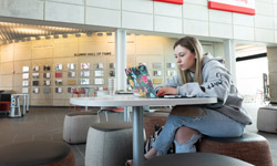SIUE student working at a desk.
