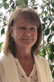 A portrait photo of Tracey Kane