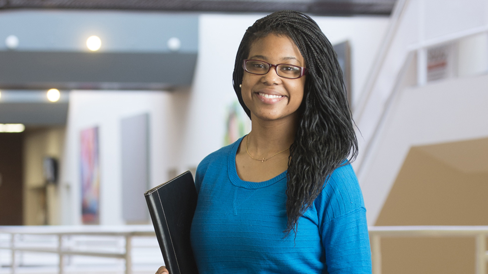 female business student smiling at camera