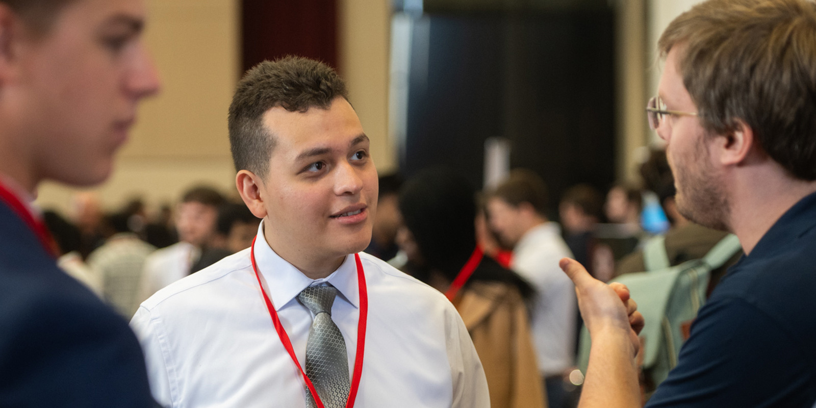 student talking to employer at career fair