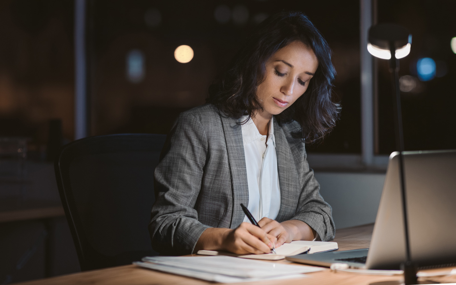 professional woman working at night