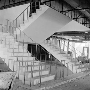 The main stairwell in the Peck Building under construction, circa 1964.