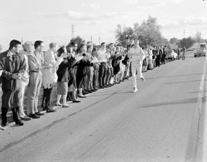 Fellow students cheer on the SIUE marathon runner as the journey to Chicago begins on November 2, 1960.