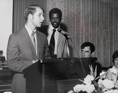 Speaking as the president of the University Center Board, with past UC president, Judge Milton Wharton looking in 1969