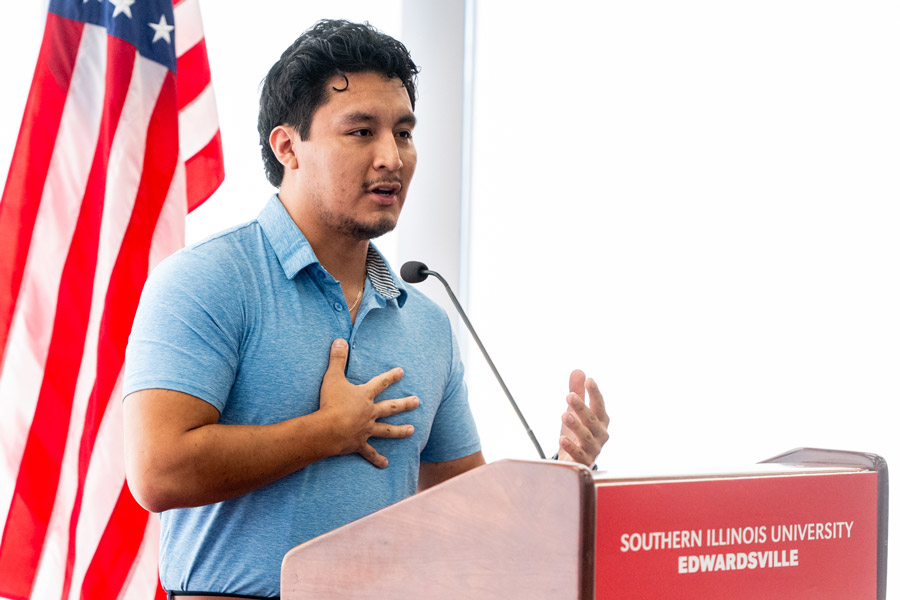 SIUE student speaking at a podium.