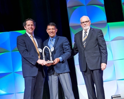 John Caupert Accepts the Award of Excellence