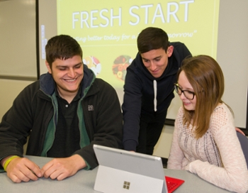 Team members (L-R) Anthony Psihramis, Brent Lallish and Kimberly Hicks work on their project, Fresh Start