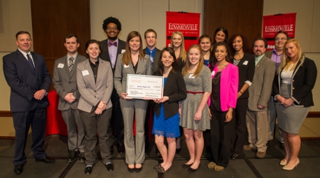 Members of Delta Sigma Pi accept a $1,000 award for being named the Enterprise Holdings Student Organization of the Year.