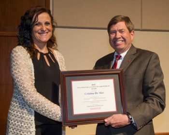 SIUE Interim Chancellor Stephen Hansen, PhD, presents the Paul Simon Outstanding Teacher-Scholar Award to Christina De Meo, PhD, professor in the Department of Chemistry in the SIUE College of Arts and Sciences.