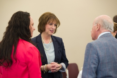 Dr. Laura Bernaix, interim dean of the SIUE School of Nursing, speaks with guests at the School's Scholarship and Awards Luncheon.