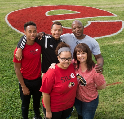 The Jambga family, (back L-R) Hadyn, Devyn, Gwinyai, (front L-R) Bailey and Stephanie, reunites during SIUE Homecoming. 