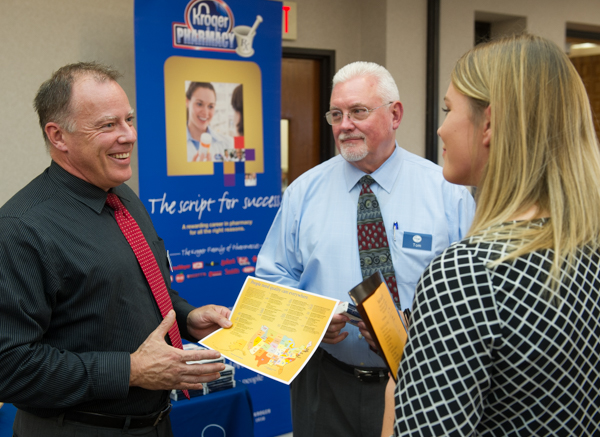 Representatives from The Kroger Co. speak with fourth-year pharmacy student Kelly Korza during the 2016 Health Careers Fair at SIUE.