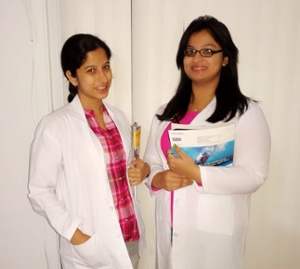 Two students from the JSS College of Pharmacy, Nickita Benny (L) and Bhagya Sree (R), are currently shadowing SIUE’s Kelly Gable, PharmD, BCPP, in the department of psychiatry in a St. Louis family healthcare center.