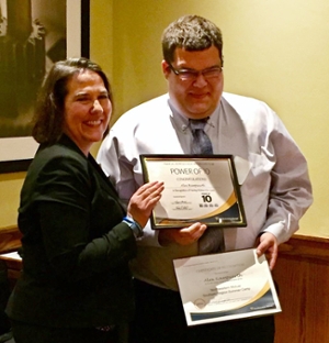 Northwestern Mutual-St. Louis’s Chief Development Officer Helen Jardine, presents SIUE’s Alex Kampwerth with his Power of 10 Award and Certificate of Recognition.