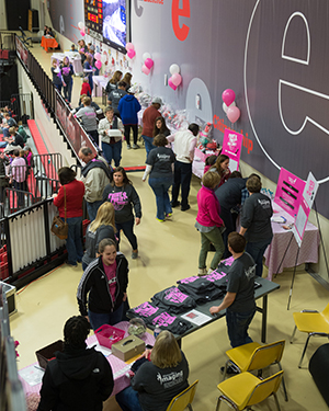 Fans check out the basket raffle and purchase Pink Zone t-shirts for breast cancer awareness during the SIUE women’s basketball game vs. Jacksonville State.