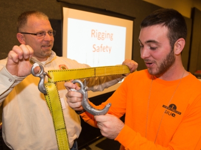 (L-R) John Mormann, instructor with the Southern Illinois Carpenters Joint Apprenticeship Program who provided the session on rigging, showed SIUE construction management student Cody Kruse the effects of side loading a hook. 
