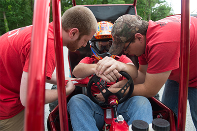 Team members tested their vehicle as they prepared for their competition in Pittsburg, Kan.