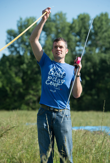 SIUE undergraduate Shawn Stumph helps Dr. Lee measure and mark research plots.