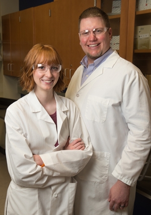 Rachel Davis (L) stands with her research mentor Kevin Tucker, PhD, assistant professor in the Department of Chemistry.