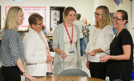 Elizabeth McKenney, PhD, associate professor of school psychology (second from right) participates in an activity with a group of school psychologists during a workshop, entitled, Instructing and Supporting Students with Autism Spectrum Disorder.