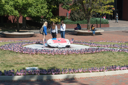 The College Republicans of SIUE placed 2,977 flags around The Rock to symbolize each life lost in the 9/11 terrorist attacks.