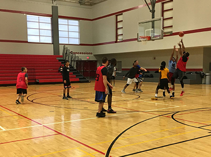 Members of Brother 2 Brother engaged in friendly competition with SIUE Police during the Unity Basketball Game.