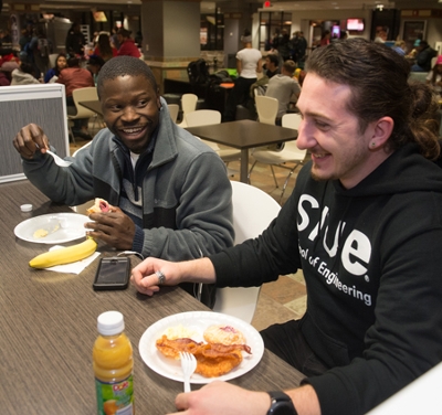 (L-R) Stephen Oke and Erim Yanik, both mechanical engineering students, enjoy a delicious late-night breakfast courtesy of SIUE’s Morris University Center, Kimmel Student Involvement Center and University Housing.