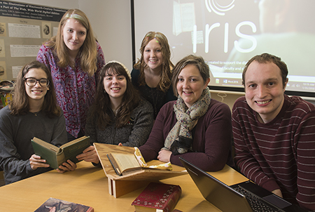 Dr. Jessica DeSpain (second from right) sits in the SIUE IRIS Center with student researchers and colleagues (L-R) Michaela Justus, Katie Knowles, Sarah Burt, Allyson Taylor and Ben Ostermeier.