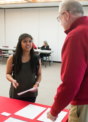 SIUE alumnus and prospective graduate student Jantzen Rosales visits with Mike Costigan, PhD, accounting professor emeritus, during the Graduate Admissions Open House.