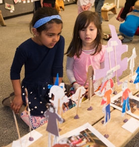 (L-R) Alayna and Sophie were excited to see and talk about their artistic creations during the SIUE Early Childhood Center's Art Exhibit.