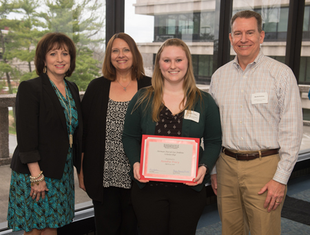 Kendra Tracy earned the inaugural Airman David Lee Jenkins Scholarship. Standing behind her (L-R) are SIUE School of Nursing Dean Laura Bernaix, and scholarship representatives Renee Van Dyke and David Jenkins.