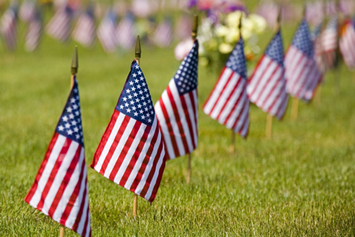 Flags on a grave site.