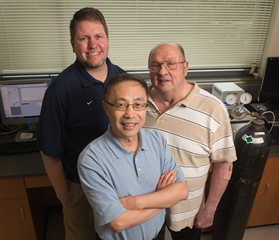 SIUE College of Arts and Sciences Department of Chemistry faculty Drs. Yun Lu (front), Kevin Tucker (left), and James Eilers (right) are collaborating on research funded by the NSF.