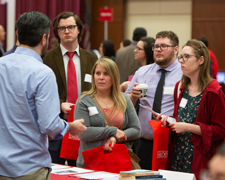Dylan Anderson, Ami Murphy, David Thompson, and Autumn Haas listened intently to a history graduate program representative at the SIUE Graduate School Open House.