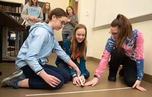 Students test catapult at 2019 IGE.