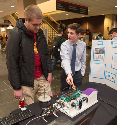 Jack White, an electrical engineering master’s candidate from O’Fallon, Ill., discussed his research project with fellow student Steven Slaby, of Edwardsville, during the SIUE Graduate School Spring Symposium.