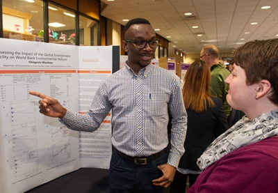 Master’s candidate Chiagozie Obuekwe shares his passion for environmental policy while explaining his research project.