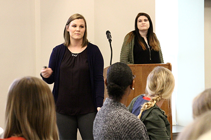 SIUE senior psychology majors Ashley Monier (front) and Abigail Haloftis (back) taught the importance of forgiveness at the Conversation Toward a Brighter Future conference.