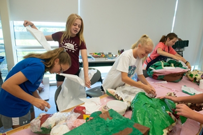 A group of camp participants from Edwardsville work on their papier mache pop art creations during Summer Arts camp. (L-R) Ella Basarich, Caitlyn Dicks, Nola Brandmeyer and Claire Martens.