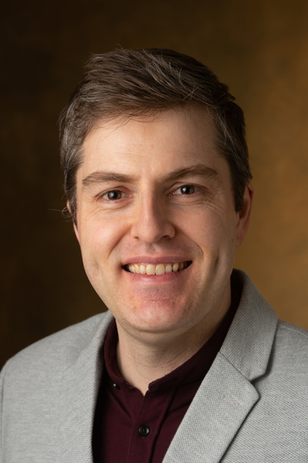 Andrew Greenwood, PhD, assistant professor of musicology and graduate program director in the College of Arts and Sciences’ Department of Music.