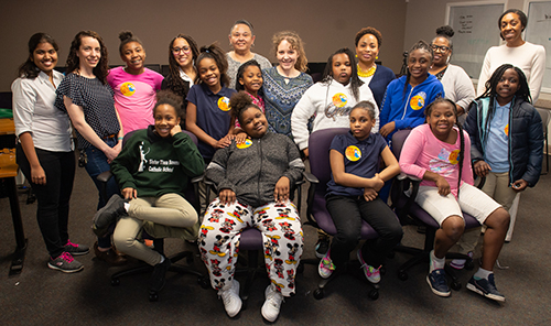 Attendees and contributors gather for a photo during the March Women in STEM event.