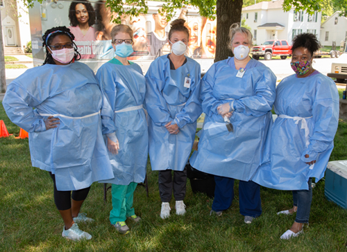 Serving the community via the Madison County Mobile Testing unit are (L-R) SOM’s fourth year student Titiana Kelly, SIUE’s Melisa Bogle, DNP, SIUE SON FNP DNP student Brooke Buffington, SOM’s Rebecca Hoffman, MD, and SOM’s Erica Austin.