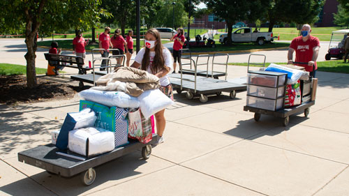 An SIUE freshman brings her belongings into her new home away from home during Move-In Day on Tuesday, Aug. 18.