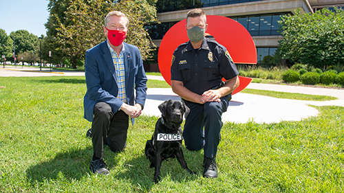 SIUE Vice Chancellor for Administration Rich Walker, SIUE’s Electronic Service Detection Dog Marshall, and SIUE Police Chief Kevin Schmoll.
