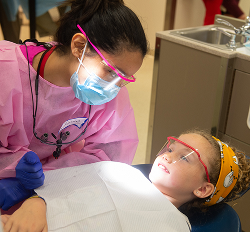 A child receives free dental care during the 2019 Give Kids a Smile Day event at the SIU School of Dental Medicine in Alton.