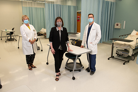 Standing in the SIUE SON’s new clinical simulation lab are (L-R) Ann Popkess, PhD, RN, CNE, assistant dean for undergraduate programs; Dean Laura Bernaix, PhD, RN, and Kevin Stein, DNP, nurse anesthesia program director.