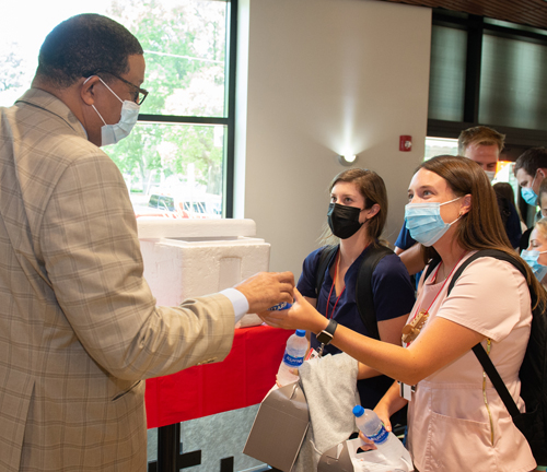 Alton Mayor David Goins offers greetings and a free Dairy Queen Blizzard® to second-year student Courtney Chapman.