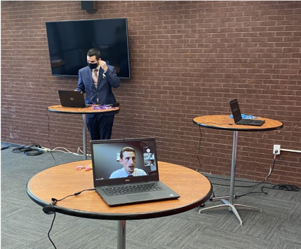 A student prepares to conduct a virtual meeting a firm representative. 