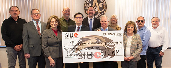 (Front L-R): Lisa Smith, SIUE Engineering; Dean Cem Karacal, SIUE Engineering; Bruce Holland, Holland Construction; Donna Richter, SICAP/SIBA; (Back L-R) Mike Bevis, Bevis Construction, Inc.; John Cabage, SIUE Construction Department Chair; Ken Kilia