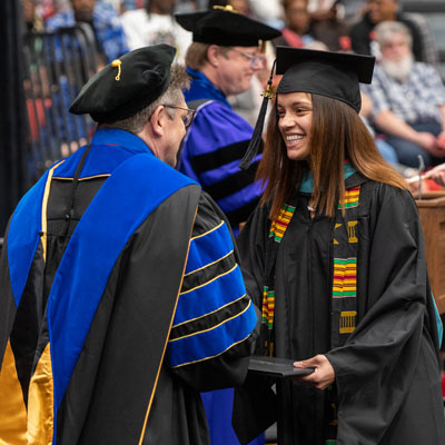 An SIUE graduate receives her master's degree.
